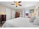 Bright main bedroom with king-size bed and ample natural light at 1827 Pine Cone Cir, Clearwater, FL 33760
