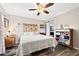 Spacious main bedroom with king-size bed and ceiling fan at 1827 Pine Cone Cir, Clearwater, FL 33760