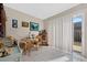Bright breakfast nook with table and chairs, offering access to a patio at 1827 Pine Cone Cir, Clearwater, FL 33760