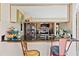 Kitchen boasts a breakfast bar and modern appliances at 1827 Pine Cone Cir, Clearwater, FL 33760