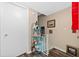Stairwell with decorative shelving and artwork at 1827 Pine Cone Cir, Clearwater, FL 33760