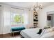 Bedroom with large window, bench, and built-in shelves at 206 W Frierson Ave, Tampa, FL 33603