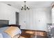 Bright bedroom with a cozy bed, dark wood furniture, and ample closet space at 206 W Frierson Ave, Tampa, FL 33603