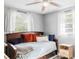 Cozy bedroom with natural light, a comfortable bed, and neutral decor at 206 W Frierson Ave, Tampa, FL 33603