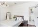 Comfortable bedroom with decorative wall paneling and attached bathroom at 206 W Frierson Ave, Tampa, FL 33603