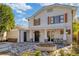 Two-story home with inviting front porch and landscaping at 206 W Frierson Ave, Tampa, FL 33603