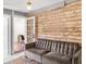 Comfortable seating area with a unique accent wall and plenty of natural light, offering a stylish and welcoming space at 206 W Frierson Ave, Tampa, FL 33603