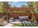 Relaxing patio area with pergola, seating, and brick paving at 206 W Frierson Ave, Tampa, FL 33603