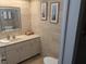 Bathroom with vanity, toilet, and decorative accents at 212 Poinciana Ln, Largo, FL 33770
