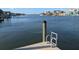 Private dock featuring boat access and a convenient ladder, ideal for waterfront enjoyment and activities at 212 Poinciana Ln, Largo, FL 33770