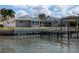 Waterfront living with a private dock, perfect for enjoying the serene views and access to the water at 212 Poinciana Ln, Largo, FL 33770