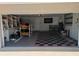 Organized garage with checkered flooring and built-in shelving, providing ample storage space at 212 Poinciana Ln, Largo, FL 33770
