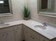 Double vanity bathroom with updated countertops and large mirrors at 212 Poinciana Ln, Largo, FL 33770