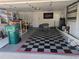 Garage with checkered floor and ample storage at 212 Poinciana Ln, Largo, FL 33770