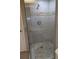 Large walk-in shower with glass enclosure and stone tile at 212 Poinciana Ln, Largo, FL 33770