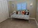 Small bedroom with daybed and plenty of natural light at 212 Poinciana Ln, Largo, FL 33770