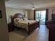 Spacious main bedroom with pool access and ensuite bathroom at 212 Poinciana Ln, Largo, FL 33770