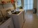 Laundry room with washer, dryer, and utility sink at 212 Poinciana Ln, Largo, FL 33770
