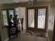 Bright entryway with double doors and decorative accents at 212 Poinciana Ln, Largo, FL 33770