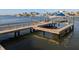 Private boat dock with lift and seating area at 212 Poinciana Ln, Largo, FL 33770
