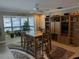 Bright dining area with water views and built-in shelving at 212 Poinciana Ln, Largo, FL 33770