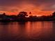 Breathtaking sunset view over the tranquil waterfront, showcasing the perfect blend of nature and serenity at 212 Poinciana Ln, Largo, FL 33770