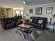 Relaxing living room with reclining sofas and a large area rug at 212 Poinciana Ln, Largo, FL 33770
