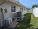 House exterior showing the AC unit and backyard at 212 Poinciana Ln, Largo, FL 33770