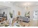 Bright dining room with wood table, chandelier, and view into kitchen at 3811 N Arlington Ave, Tampa, FL 33603