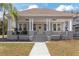 Gray craftsman home with white columns, front porch, and landscaping at 3811 N Arlington Ave, Tampa, FL 33603