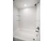 Clean bathroom with white subway tile and shower/tub at 416 Meadow Ln, Oldsmar, FL 34677