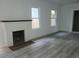 Living room with fireplace and grey wood-look floors at 4736 20Th N St, St Petersburg, FL 33714