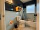 Bathroom with light blue tiled walls and tub at 5018 Chancellor Ne St, St Petersburg, FL 33703