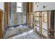 A bathroom currently under construction, showing exposed plumbing and framing at 7951 Gulf Blvd, St Pete Beach, FL 33706