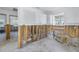 A kitchen remodel showing exposed walls and utilities; appliances are present at 7951 Gulf Blvd, St Pete Beach, FL 33706