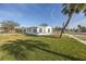 Newly renovated home with a large grassy yard at 7951 Gulf Blvd, St Pete Beach, FL 33706