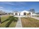 Newly renovated home with a walkway leading to the entrance at 7951 Gulf Blvd, St Pete Beach, FL 33706