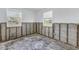A bedroom under renovation, showing exposed walls and flooring at 7951 Gulf Blvd, St Pete Beach, FL 33706