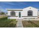Newly renovated home with a walkway leading to the entrance at 7951 Gulf Blvd, St Pete Beach, FL 33706