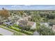 Aerial view of condo community near a lake and surrounding neighborhood at 9016 Shallowford Ln # 202, Port Richey, FL 34668