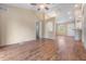 Bright living room featuring wood-look floors and a high ceiling at 9016 Shallowford Ln # 202, Port Richey, FL 34668