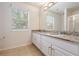 Bathroom with double vanity, granite countertop, and shower at 9016 Shallowford Ln # 202, Port Richey, FL 34668