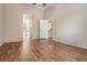 Spacious bedroom with wood-look flooring and ceiling fan at 9016 Shallowford Ln # 202, Port Richey, FL 34668