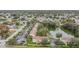 Aerial view of condo community near a lake and surrounding neighborhood at 9016 Shallowford Ln # 202, Port Richey, FL 34668
