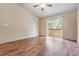 Bedroom with sliding glass doors leading to a private balcony at 9016 Shallowford Ln # 202, Port Richey, FL 34668