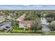 Aerial view of condo community near a lake and surrounding neighborhood at 9016 Shallowford Ln # 202, Port Richey, FL 34668