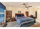 Comfortable main bedroom with a king-size bed and ample built-in shelving at 9413 Stonewall Ln, New Port Richey, FL 34655