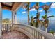 Balcony overlooking the water with a chair at 101 12Th E St, Tierra Verde, FL 33715