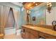 Bathroom with a granite vanity and soaking tub at 101 12Th E St, Tierra Verde, FL 33715