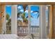 Bedroom with French doors and water views at 101 12Th E St, Tierra Verde, FL 33715